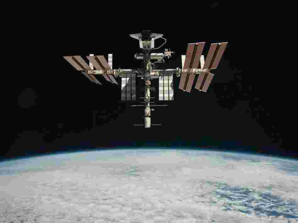 The International Space Station and the docked space shuttle Endeavour, flying at an altitude of approximately 220 miles, on May 23, 2011.