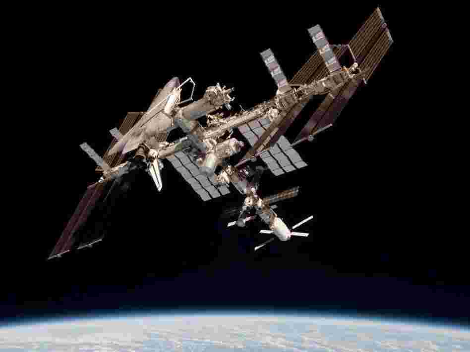 The International Space Station and the docked space shuttle Endeavour, flying at an altitude of approximately 220 miles, on May 23, 2011.