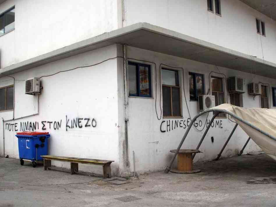 Graffiti at the smaller Greek pier at Piraeus says "Chinese go home." Greece's dockworkers unions were opposed to the Chinese involvement at Piraeus, although among the general public, the mood was more positive.
