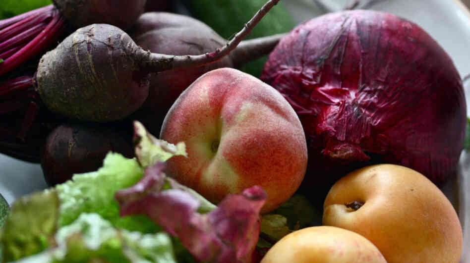 An assortment of fruit and vegetables in a bowl