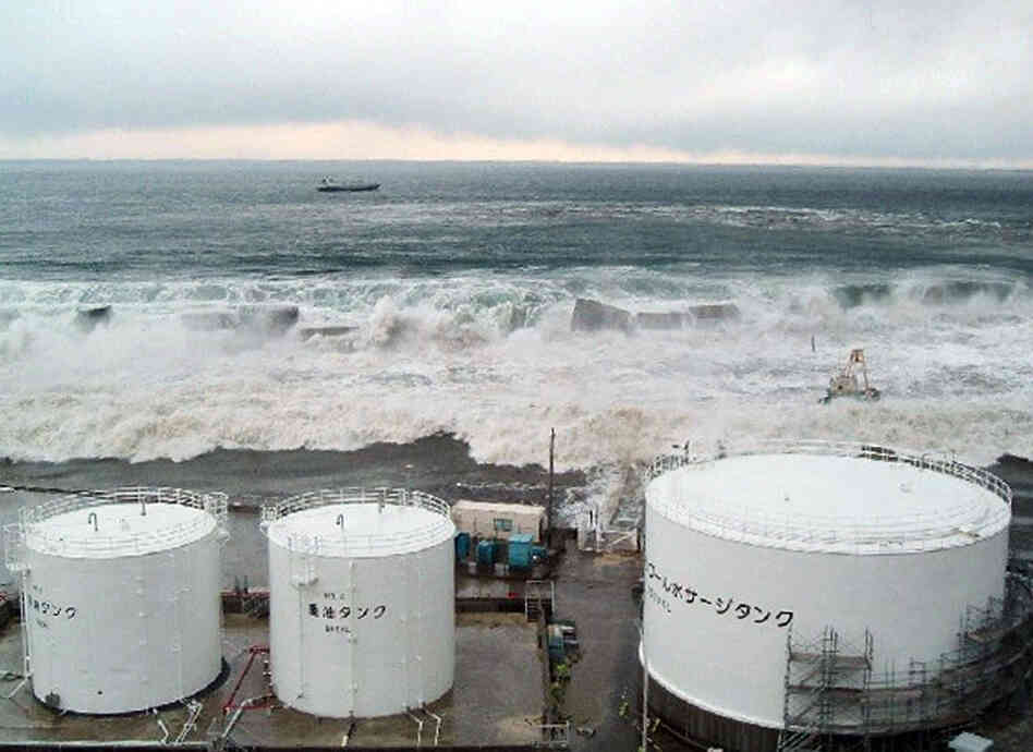 The tsunami flows over sea walls towards TEPCO's Fukushima Daiichi nuclear power plant on March 11, 2011. This photo was taken by Tokyo Electric Power Company. The tsunami flows over sea walls towards TEPCO's Fukushima Daiichi nuclear power plant on March 11, 2011. This photo was taken by Tokyo Electric Power Company.
