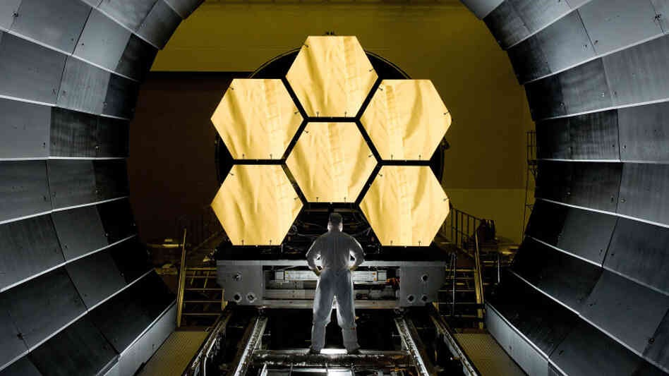 NASA engineer Ernie Wright looks on as the first six primary mirror segments for the James Webb Space Telescope are prepped to begin final cryogenic testing at NASA's Marshall Space Flight Center. The telescope will have 18 primary mirror segments. NASA engineer Ernie Wright looks on as the first six primary mirror segments for the James Webb Space Telescope are prepped to begin final cryogenic testing at NASA's Marshall Space Flight Center. The telescope will have 18 primary mirror segments.