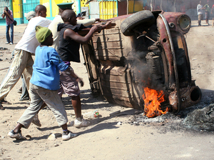 Last September, Mozambican protesters overturned a burning car in Maputo. Police patrolled the streets of the tense capital after President Armando Guebuza called for calm following protests over food and fuel prices. Last September, Mozambican protesters overturned a burning car in Maputo. Police patrolled the streets of the tense capital after President Armando Guebuza called for calm following protests over food and fuel prices.