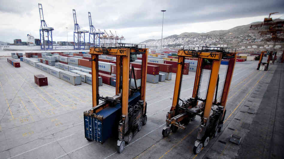 Greek dockworkers unions say there have been two accidents in one year on the Chinese-run pier at Piraeus involving straddle carriers like these, seen in December 2010. The unions say a lack of specialty training is likely to blame. The Chinese company Cosco doesn't allow unions or collective bargaining among its 500-plus Greek workers. Greek dockworkers unions say there have been two accidents in one year on the Chinese-run pier at Piraeus involving straddle carriers like these, seen in December 2010. The unions say a lack of specialty training is likely to blame. The Chinese company Cosco doesn't allow unions or collective bargaining among its 500-plus Greek workers.