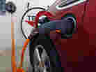 A Chevy Volt electric car charges in a garage. To make electric cars like the Volt more viable for consumers, manufacturers need to build better batteries, says science writer Seth Fletcher.