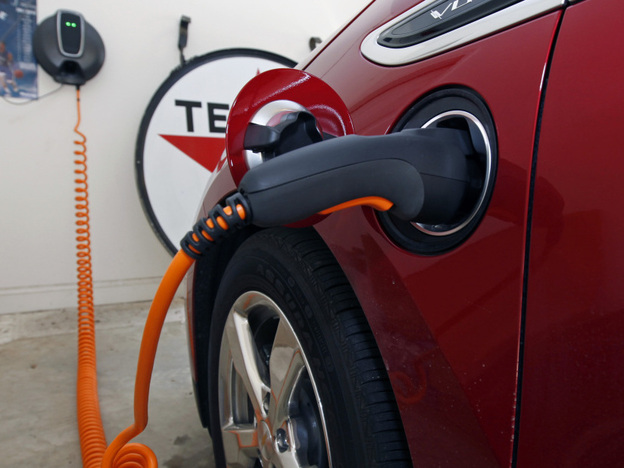 A Chevy Volt electric car charges in a garage. To make electric cars like the Volt more viable for consumers, manufacturers need to build better batteries, says science writer Seth Fletcher.