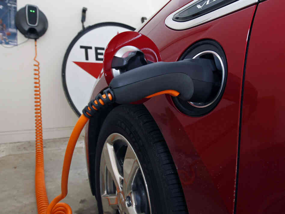 A Chevy Volt electric car charges in a garage. To make electric cars like the Volt more viable for consumers, manufacturers need to build better batteries, says science writer Seth Fletcher.