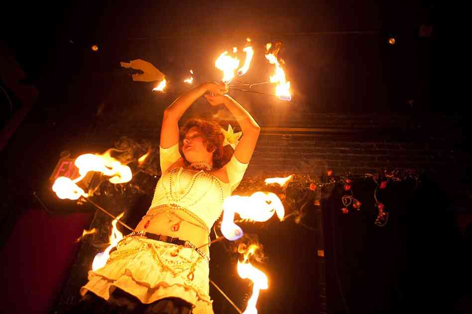 Anna Jacobson, a 24-year-old Brooklynite who enjoys fire dancing, is one of the subjects in Amira Al-Sharif's photo project.