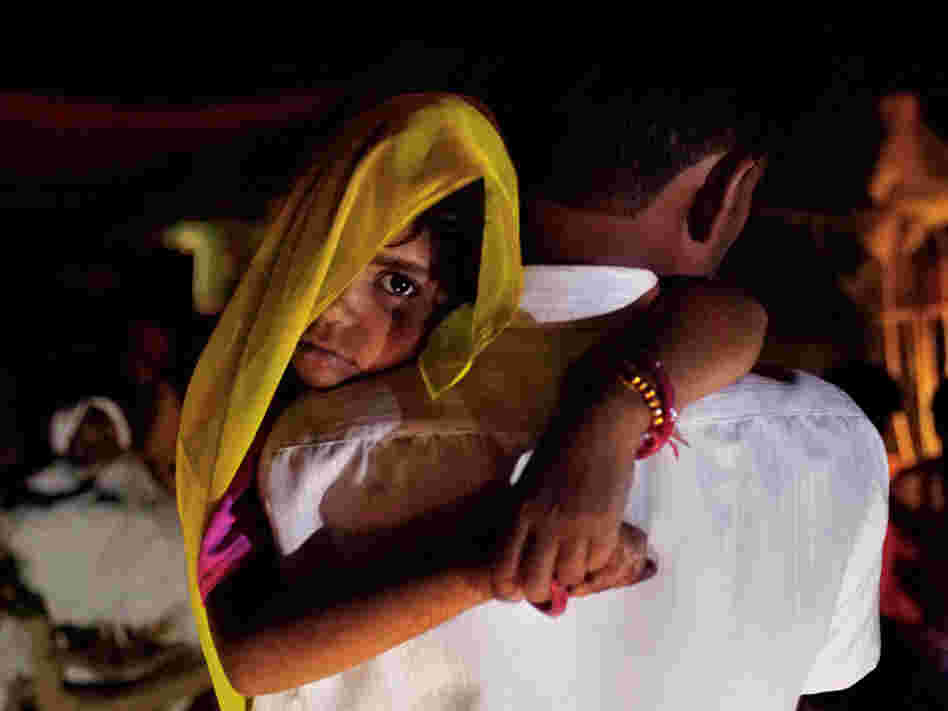 Long after midnight, 5-year-old Rajani is roused from sleep and carried by her uncle to her wedding. Child marriage is illegal in India, so ceremonies are often held in the wee hours of morning. It becomes a secret the whole village keeps, explained one farmer.