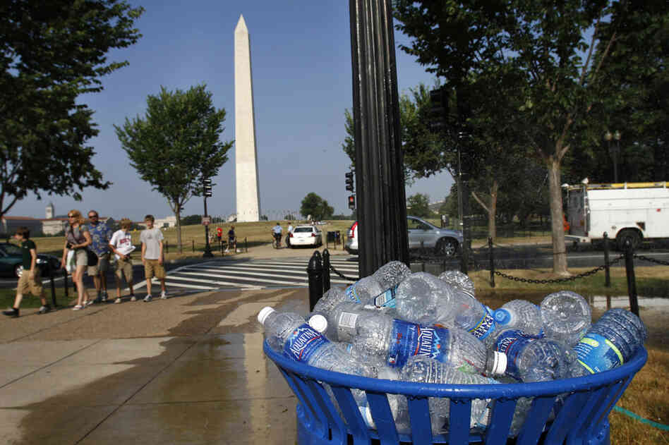 A recycling bin overflows with discarded water bottles on the National Mall in Washington, D.C. 
