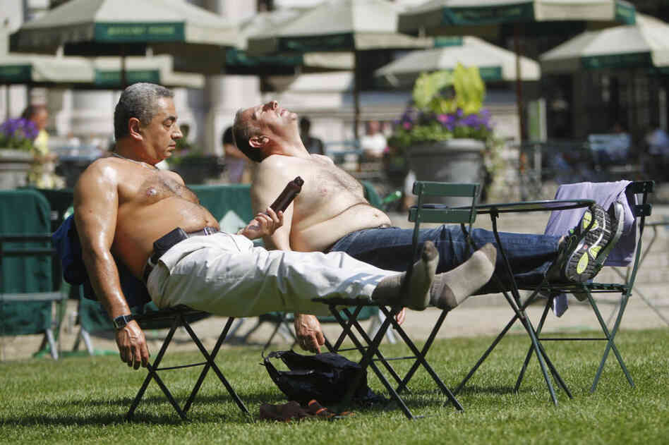 Sunbathers bask in New York City's Bryant Park on Wednesday. Authorities blamed the heat for the recent deaths of five elderly people in Tennessee, Maryland and Wisconsin. 
