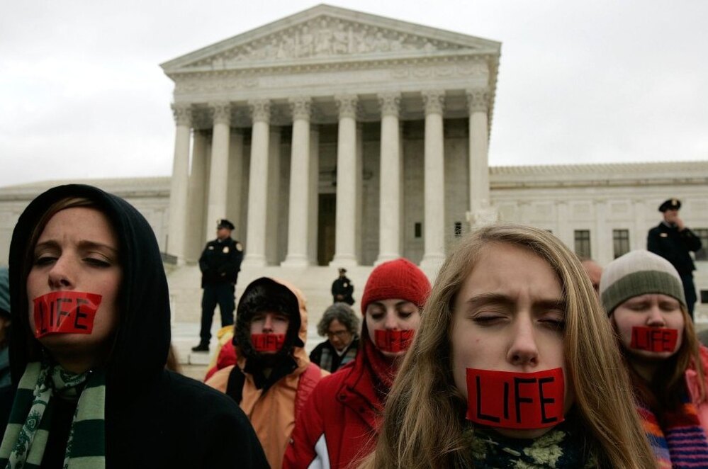 Members of Bound 4 Life, a group opposed to abortion rights, pray in front of the U.S. Supreme Court in early 2006.