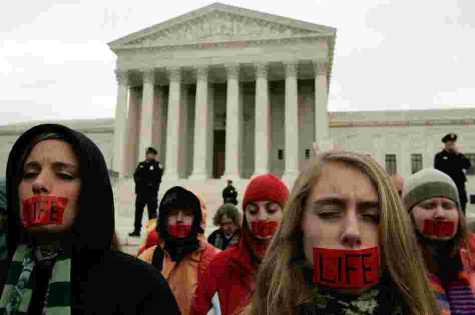 Members of Bound 4 Life, a group opposed to abortion rights, pray in front of the U.S. Supreme Court in early 2006.