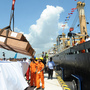 Workers unload cargo from the first vessel to enter the Chinese-funded port in Hambantota, Sri Lanka, in November 2010. China's Export-Import Bank provided 85 percent of the financing for construction of the port. Workers unload cargo from the first vessel to enter the Chinese-funded port in Hambantota, Sri Lanka, in November 2010. China's Export-Import Bank provided 85 percent of the financing for construction of the port.