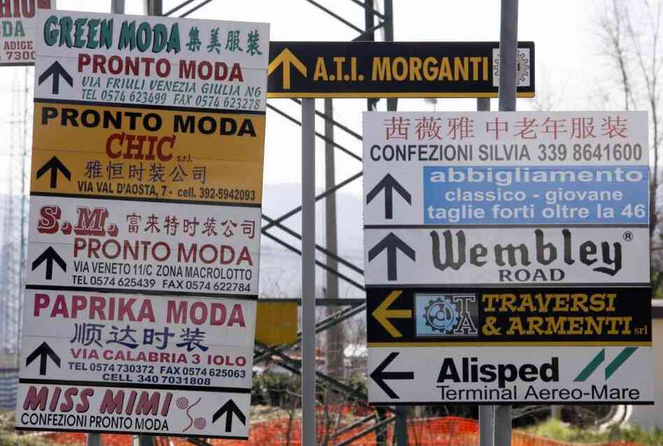 Street signs cater to the languages spoken in Prato. Street signs cater to the languages spoken in Prato.