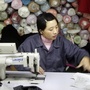 A Chinese employee works in a textile firm in the Macrolotto area in Prato, the biggest textile district in Europe, in 2005. The town has become home to the largest concentration of Chinese residents in Europe — many of whom are not legal.