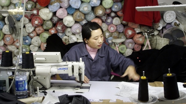 A Chinese employee works in a textile firm in the Macrolotto area in Prato, the biggest textile district in Europe, in 2005. The town has become home to the largest concentration of Chinese residents in Europe — many of whom are not legal.