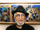 M.F Husain in London in 2007. One of his paintings, which depicts Mother Teresa taking care of children, is in the background. M.F Husain in London in 2007. One of his paintings, which depicts Mother Teresa taking care of children, is in the background.
