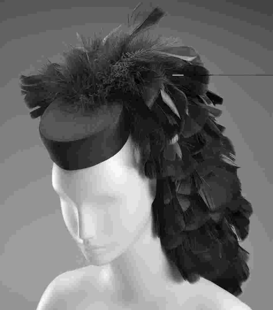 A cocktail hat circa 1963 by Cristobal Balenciaga. Silk, tulle, feathers, plastic, satin weave.
