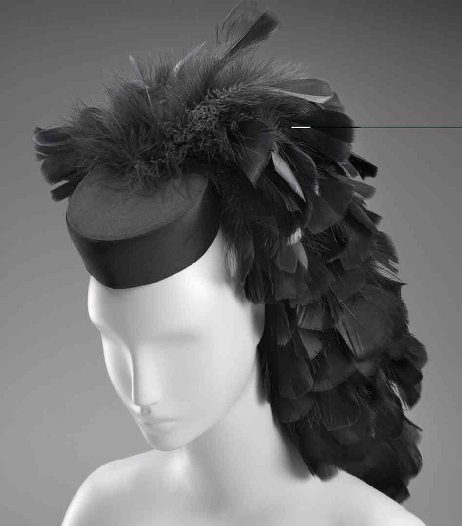 A cocktail hat circa 1963 by Cristobal Balenciaga. Silk, tulle, feathers, plastic, satin weave.