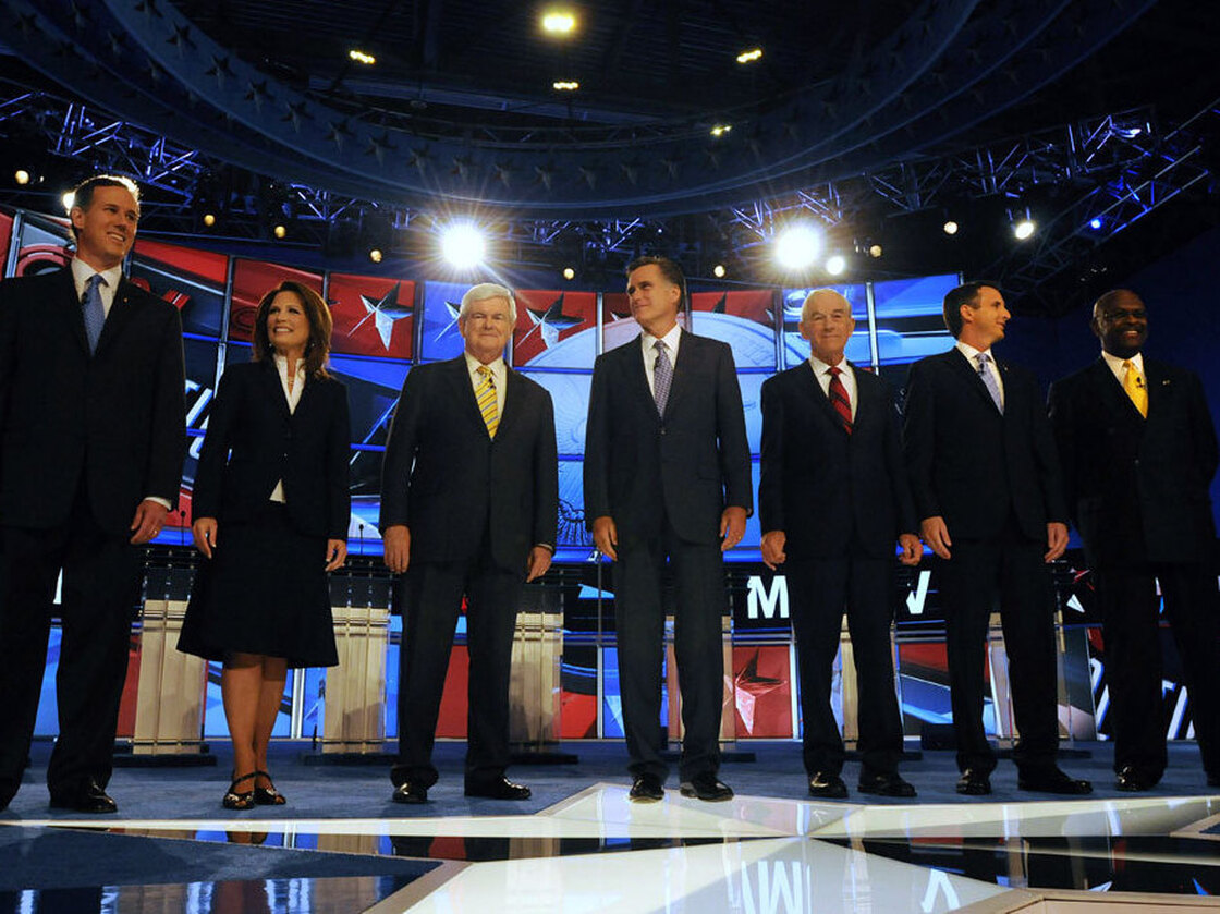 Republican candidates (L to R) former U.S. Sen. Rick Santorum (PA), U.S.  Rep. Michele Bachmann (MN), former House Speaker Newt Gingrich, former  Governor Mitt Romney (MA), U.S. Rep. Ron Paul (TX), former Governor Tim  Pawlenty (MN), and businessman Herman Cain prepare for their debate June  13, 2011 at Saint Anselm College in Manchester, New Hampshire.