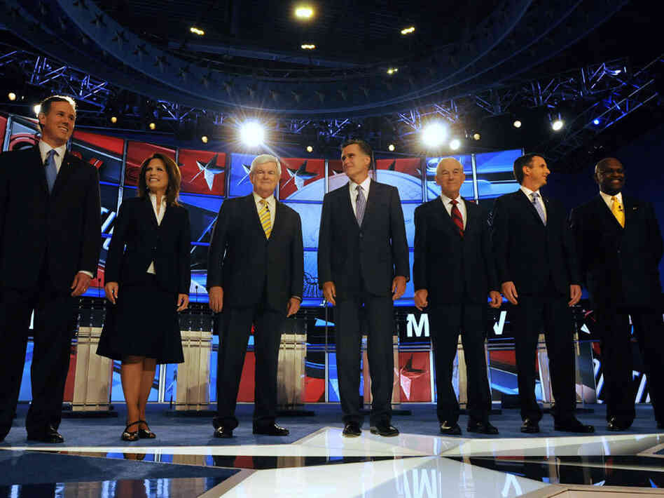 Republican candidates (L to R) former U.S. Sen. Rick Santorum (PA), U.S.  Rep. Michele Bachmann (MN), former House Speaker Newt Gingrich, former  Governor Mitt Romney (MA), U.S. Rep. Ron Paul (TX), former Governor Tim  Pawlenty (MN), and businessman Herman Cain prepare for their debate June  13, 2011 at Saint Anselm College in Manchester, New Hampshire.