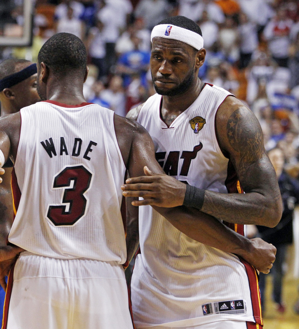 James hugs Dwyane Wade after the game.