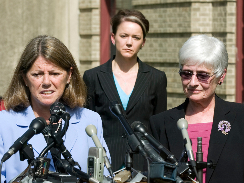 Rhode Island Education Commissioner Deborah Gist, (center) looks on as Central Falls School Superintendent Frances Gallo (right) and Central Falls Teachers' Union President Jane Sessums (left) talk to the media just after the union approved an agreement allowing the entire staff to be rehired last May.