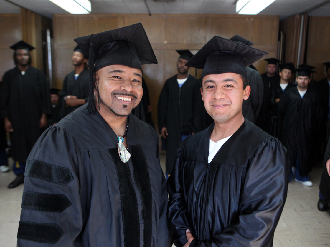 Phillip Senegal (left) and valedictorian Felix Lucero earned associate of arts degrees in 2009 at a ceremony in San Quentin state prison, where they are inmates. The college program is an extension of Patten University in Oakland, Calif.