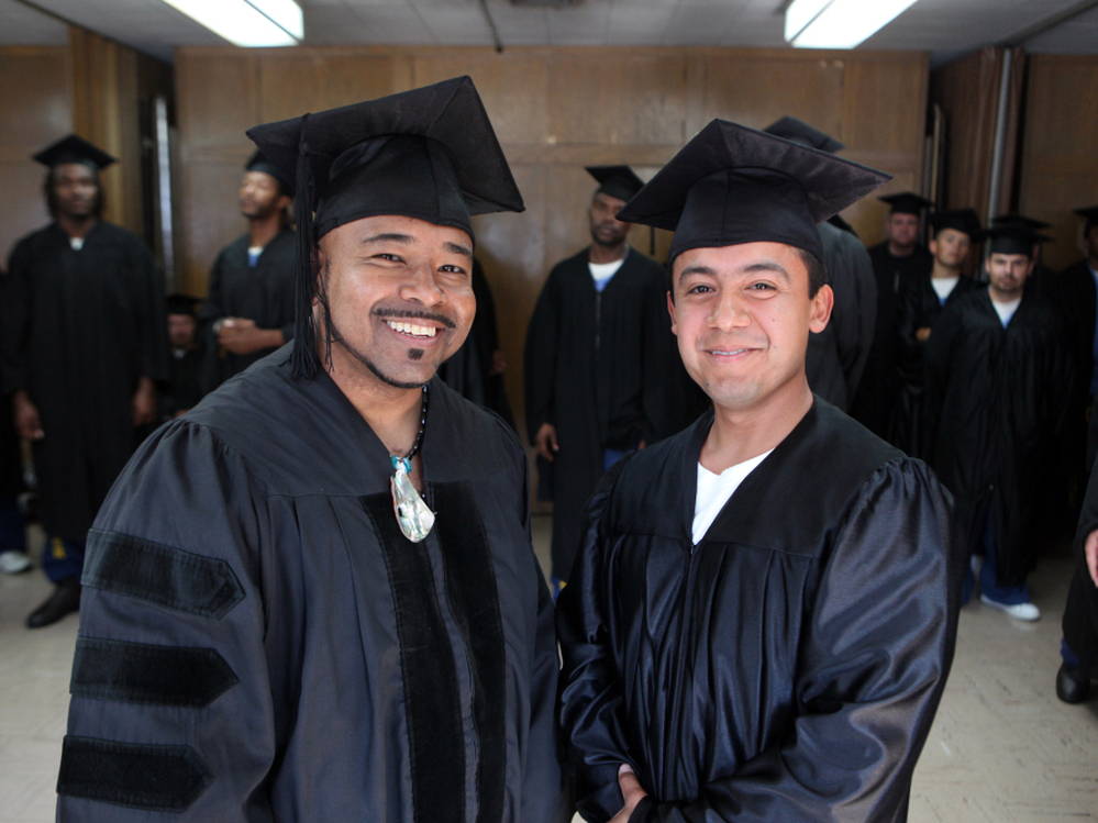 Phillip Senegal (left) and valedictorian Felix Lucero earned associate of arts degrees in 2009 at a ceremony in San Quentin state prison, where they are inmates. The college program is an extension of Patten University in Oakland, Calif.