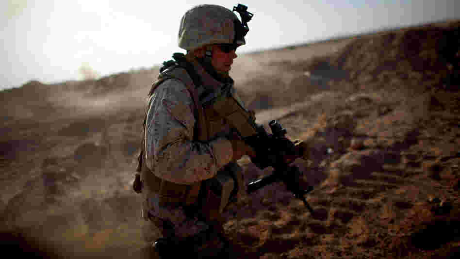 Sgt. Joseph Garrison with Fox Company, 2nd Battalion, 8th Marine Regiment, runs through the desert near Camp Leatherneck during a drill in June 2009. Garrison was killed while on his fourth combat deployment to Afghanistan in June 2011, when he was struck by a homemade bomb in Marjah. Sgt. Joseph Garrison with Fox Company, 2nd Battalion, 8th Marine Regiment, runs through the desert near Camp Leatherneck during a drill in June 2009. Garrison was killed while on his fourth combat deployment to Afghanistan in June 2011, when he was struck by a homemade bomb in Marjah.