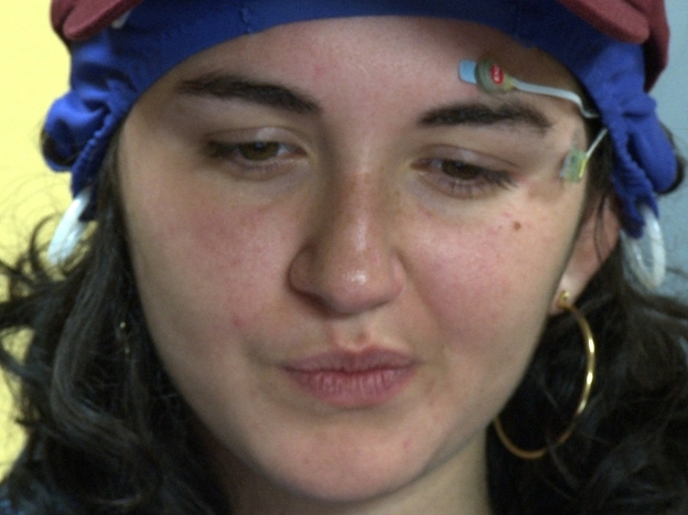 Maya wears the EEG cap and watches the commercial at the  headquarters of NeuroFocus in Berkeley, Calif.