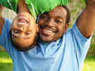 A father and son play.