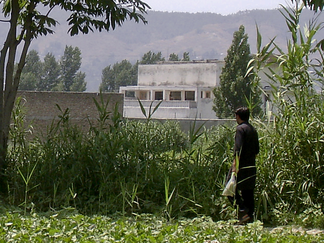 A local resident walks Wednesday near Osama bin Laden's compound in Abbottabad, Pakistan. The U.S. raid that killed bin Laden has been a source of tension in U.S.-Pakistani relations.