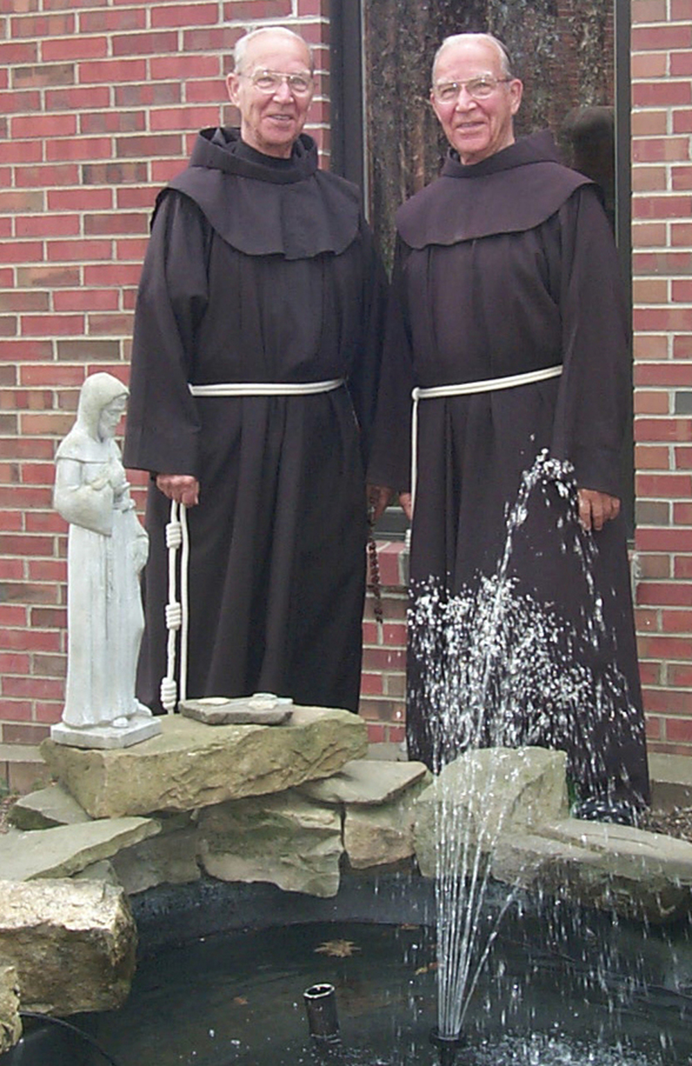 May 2003 photo provided by St. Bonaventure University of shows Adrian, left, and Julian Riester, identical twins and brothers in the Order of Friars Minor.