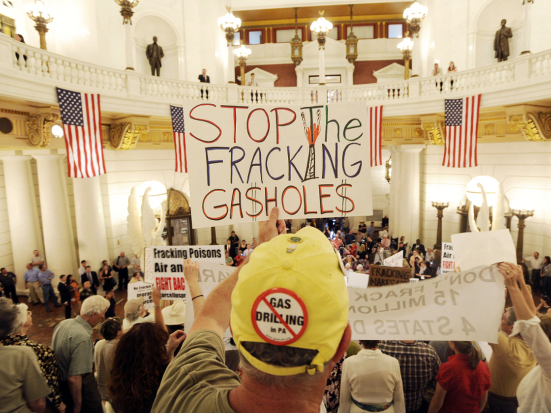 An environmental clean water protester participates in a rally at the Pennsylvania state capitol in Harrisburg against the drilling of the Marcellus Shale natural gas formation.