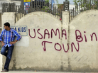 May 6, 2011: A man leans against a wall in Abbottabad, Pakistan, near the compound where al-Qaida leader Osama bin Laden was discovered and killed.
