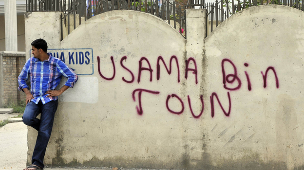 May 6, 2011: A man leans against a wall in Abbottabad, Pakistan, near the compound where al-Qaida leader Osama bin Laden was discovered and killed.