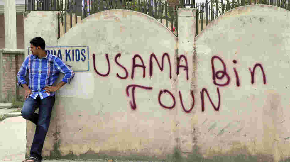 May 6, 2011: A man leans against a wall in Abbottabad, Pakistan, near the compound where al-Qaida leader Osama bin Laden was discovered and killed.