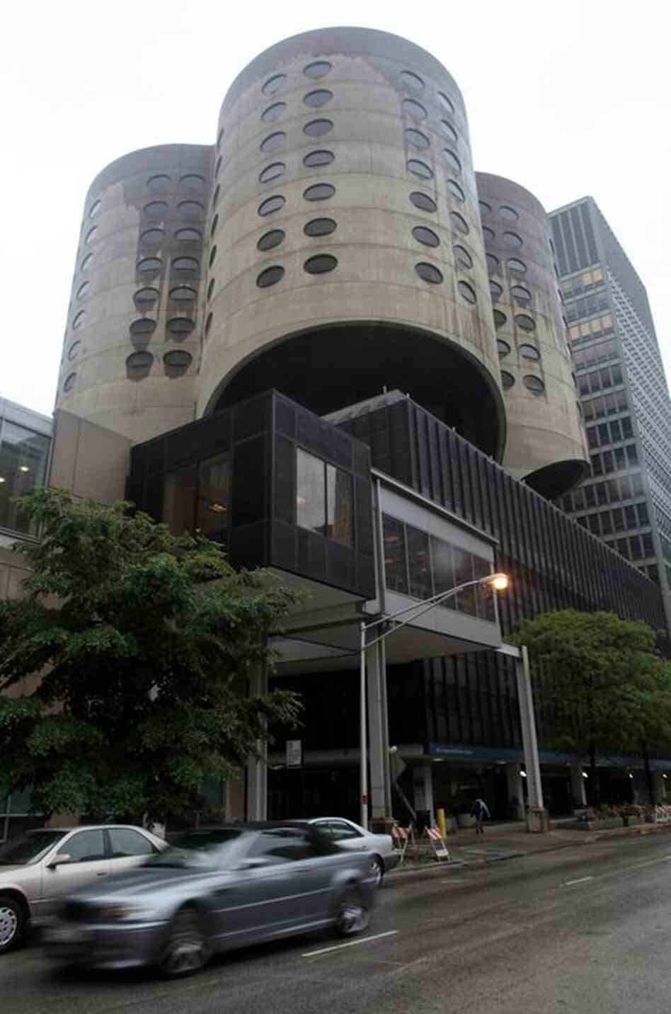 The cloverleaf-shaped Prentice Women's Hospital building in Chicago, designed by architect Bertrand Goldberg, opened in 1974. The open-floor plan was designed to create four circular villages of care. The hospital relocated to a new building in 2007 and the vacant tower faces demolition. 