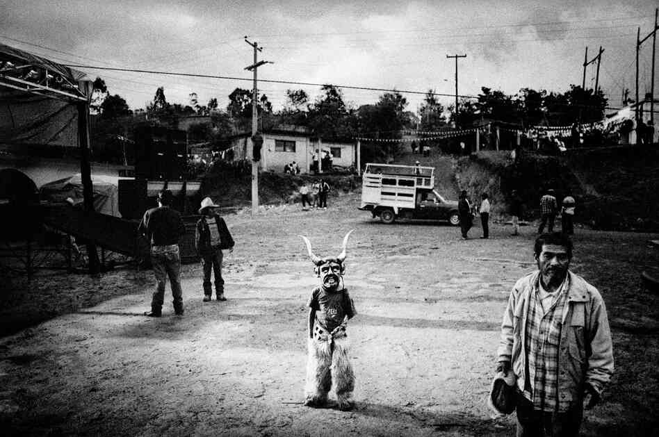 Dressed for ceremonial dancing, a boy awaits the start of his town's Saint's Day celebration, San Pedro Chayuco, Mexico. Dressed for ceremonial dancing, a boy awaits the start of his town's Saint's Day celebration, San Pedro Chayuco, Mexico.