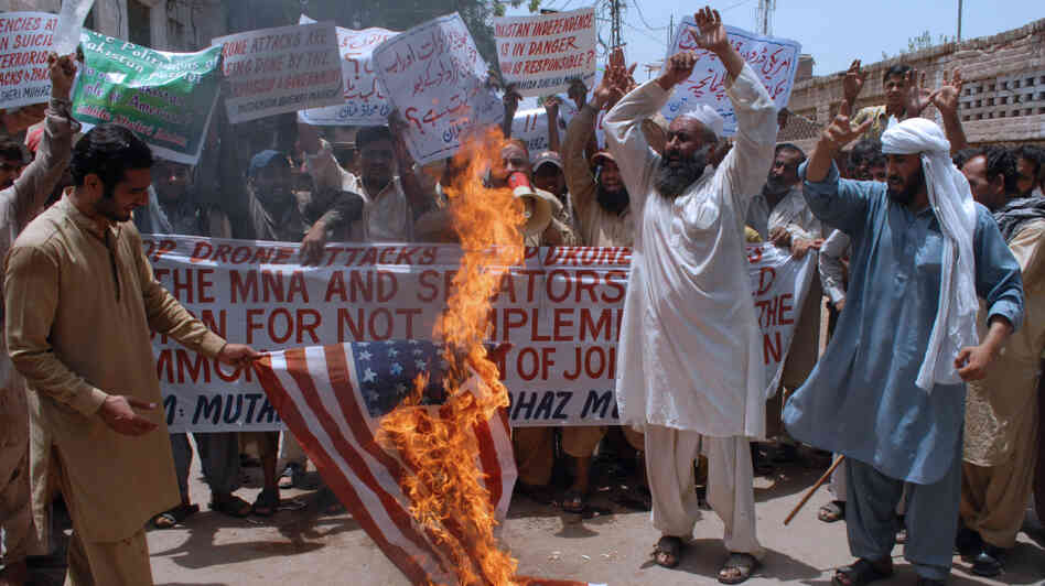 Activists of Pakistan Mutahida Shehri Mahaz burn a U.S. flag during a protest in Multan on June 16, 2011, against U.S. drone attacks. Fifteen drone strikes have now been reported in Pakistan's tribal belt since U.S. commandos found and killed Al-Qaeda chief Osama bin Laden.