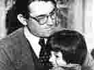 Gregory Peck embraces Mary Badham, 9, a Birmingham Alabama acting discovery who plays his daughter in "To Kill a Mockingbird"  March 1963.