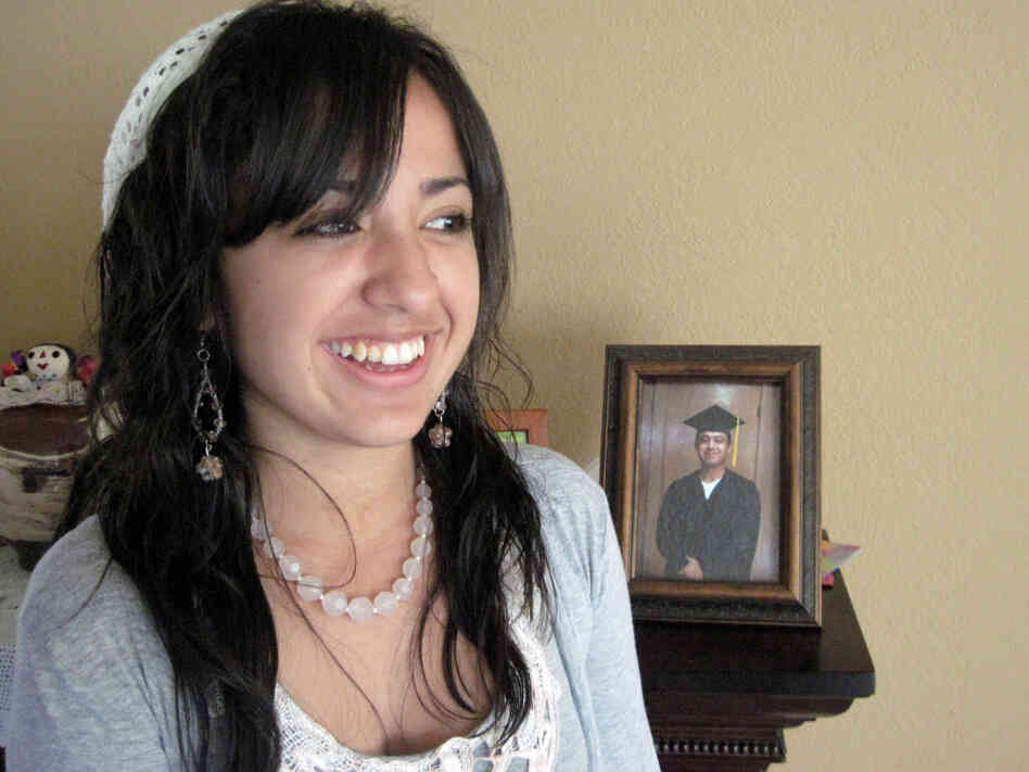 Desiree Lucero, 17, is inspired to go to college by her father, Felix, shown wearing the graduation cap and gown in the framed photo. Felix earned his Associate's Degree from San Quentin's college program in 2009. He has been incarcerated since Desiree was a year old.