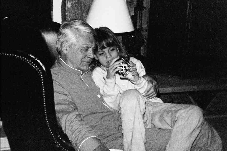 Jennifer Grant and her father work on a Rubik's Cube-type game during a ski trip to Vail, Colo. around 1976.