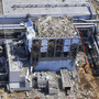 This March 24 aerial photo shows the extent of damage at the Fukushima Dai-ichi nuclear power plant in Japan. The 40-foot-tall tsunami destroyed the electrical and cooling systems, resulting in meltdowns at some of the reactors.