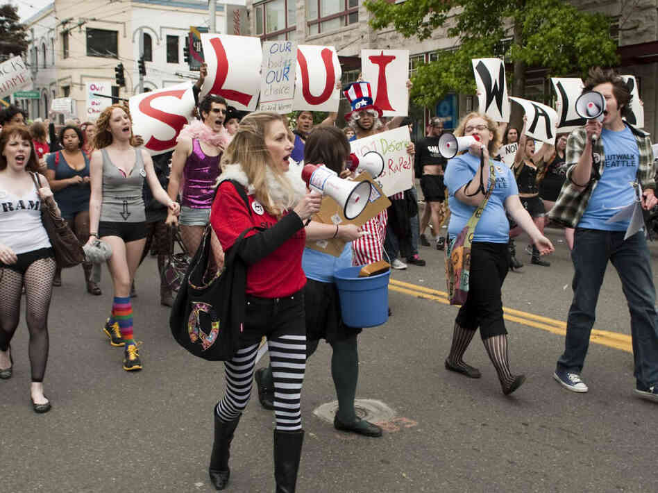 Protesters march at the SlutWalk in Seattle on June 19. SlutWalks began in April when a Toronto police officer suggested women "avoid dressing like sluts" to not be victimized. Protesters march at the SlutWalk in Seattle on June 19. SlutWalks began in April when a Toronto police officer suggested women "avoid dressing like sluts" to not be victimized.