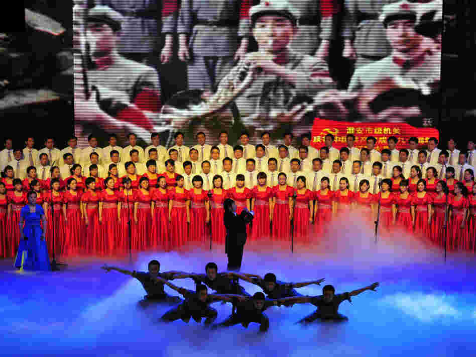 Officers from Huaian city perform patriotic "red songs" at the Huaian Great Hall of the People to mark the 90th anniversary of the founding of the Communist Party of China.