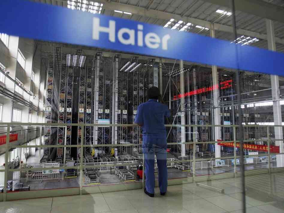 A worker stands in a warehouse at China's Qingdao Haier refrigerator factory. Despite being the world's largest maker of refrigerators, Haier is not widely known as a Chinese company. A worker stands in a warehouse at China's Qingdao Haier refrigerator factory. Despite being the world's largest maker of refrigerators, Haier is not widely known as a Chinese company.