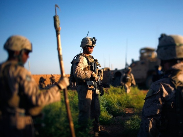 Marines pause during an operation earlier this month in Marjah, Helmand Province, Afghanistan.